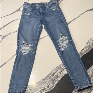 American Eagle Outfitters Ripped Blue Skinny Jeans real good. Size 4